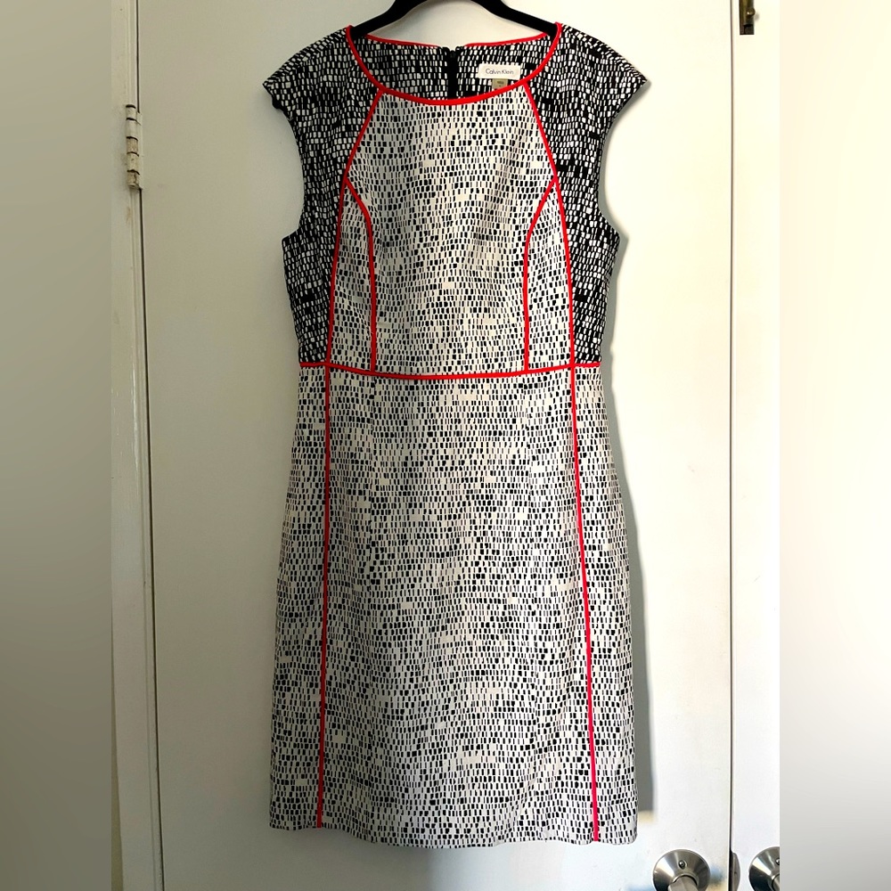 Calvin Klein dress with black and white pattern with orange accent
